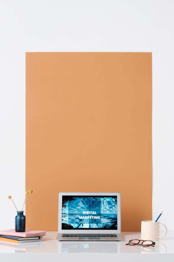 team-01 Modern workspace featuring a laptop with a digital marketing screen, ideal for business and technology themes.